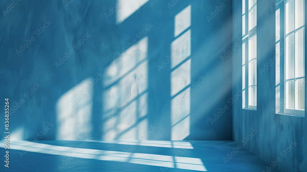 Obraz premium blue empty room with window and light shining through 