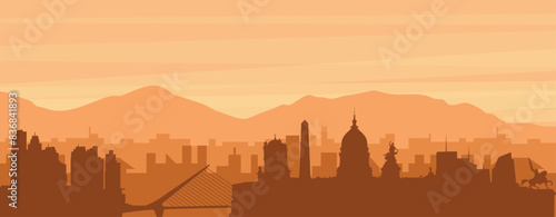 Brown panoramic poster of the city skyline with misty background buildings, sunrise, clouds and mountains of BUENOS AIRES, ARGENTINA