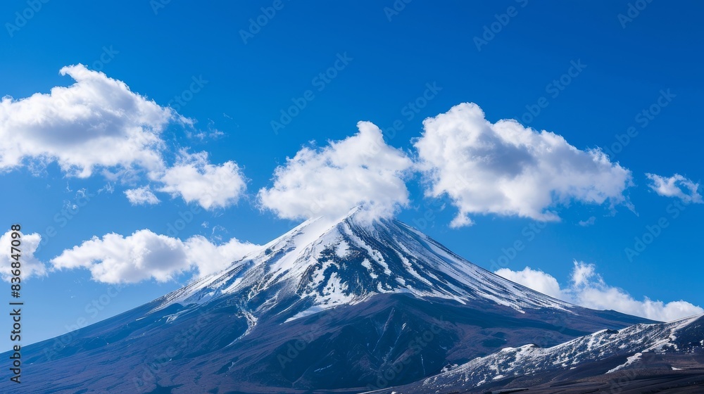 Snow-Capped Mountain Peak Against Blue Sky: Climate Change Awareness Concept Snow-Capped Mountain Peak Against Blue Sky: Climate Change Awareness Concept