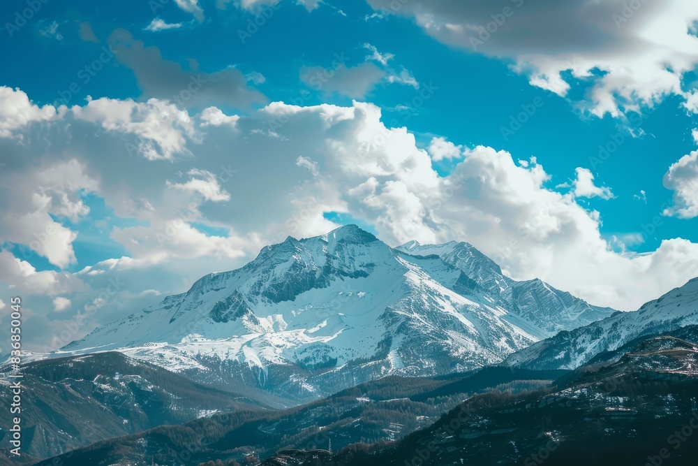 Obraz premium Majestic Snow-Covered Mountain Range with Clear Sky for Text Placement