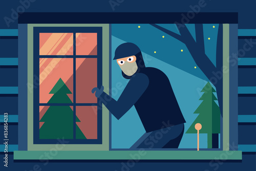 a thief with a crowbar near the house at night. The man is wearing a hat, mask and gloves, he is trying to break into the house. safety and security atmosphere