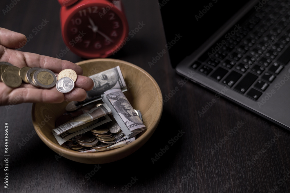 She felt deep sense of fulfillment when donating money to church, placing her tithe of coins and cash into offering bowl, knowing her giving would help fund important causes. donating, money, tithe. She felt deep sense of fulfillment when donating money to church, placing her tithe of coins and cash into offering bowl, knowing her giving would help fund important causes. donating, money, tithe.
