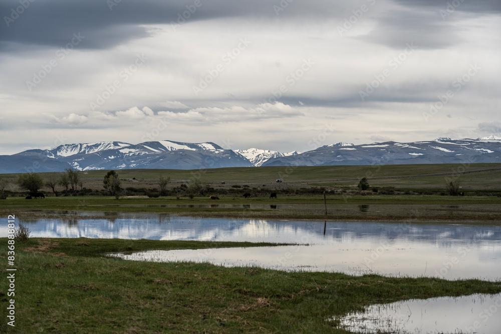 landscape of the surroundings of the village of Kosh Agach mountains with lakes and unusual landscapes in the southern regions of Altai in May landscape of the surroundings of the village of Kosh Agach mountains with lakes and unusual landscapes in the southern regions of Altai in May
