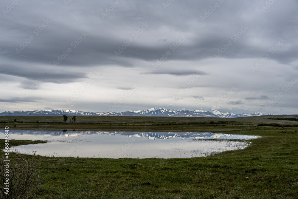 landscape of the surroundings of the village of Kosh Agach mountains with lakes and unusual landscapes in the southern regions of Altai in May landscape of the surroundings of the village of Kosh Agach mountains with lakes and unusual landscapes in the southern regions of Altai in May