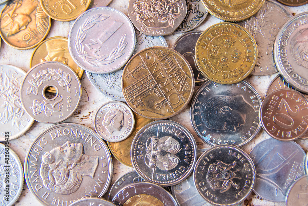 Pile of gold and silber coins on the natural background. Pile of gold and silber coins on the natural background.