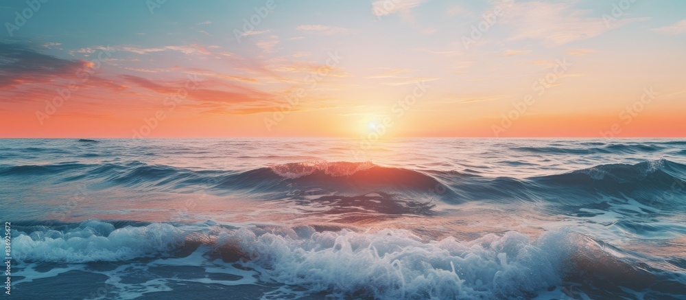Capture a picturesque sunrise over the ocean with radiant waves, perfect for a copy space image. Capture a picturesque sunrise over the ocean with radiant waves, perfect for a copy space image.