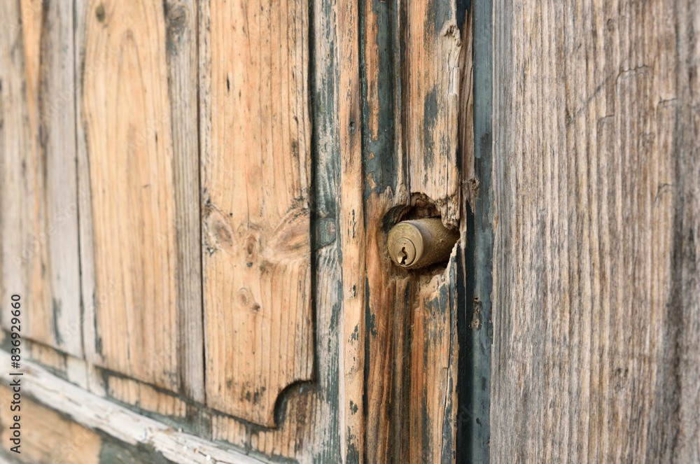 Old wooden door with modern door lock cylinder Old wooden door with modern door lock cylinder