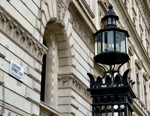 Low angle view of Downing Street sign on the wall of a building in Westminster, London, UK. 