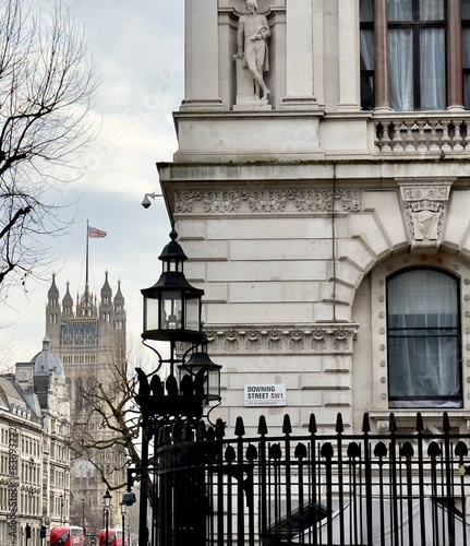 A view of the entrance to Downing Street from Whitehall with the Houses of Parliament building in the background, Westminster, London, SW1, UK. 