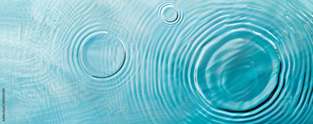 Close-up image of water surface with gentle ripples and concentric rings, capturing the serene and refreshing essence of calm water Close-up image of water surface with gentle ripples and concentric rings, capturing the serene and refreshing essence of calm water