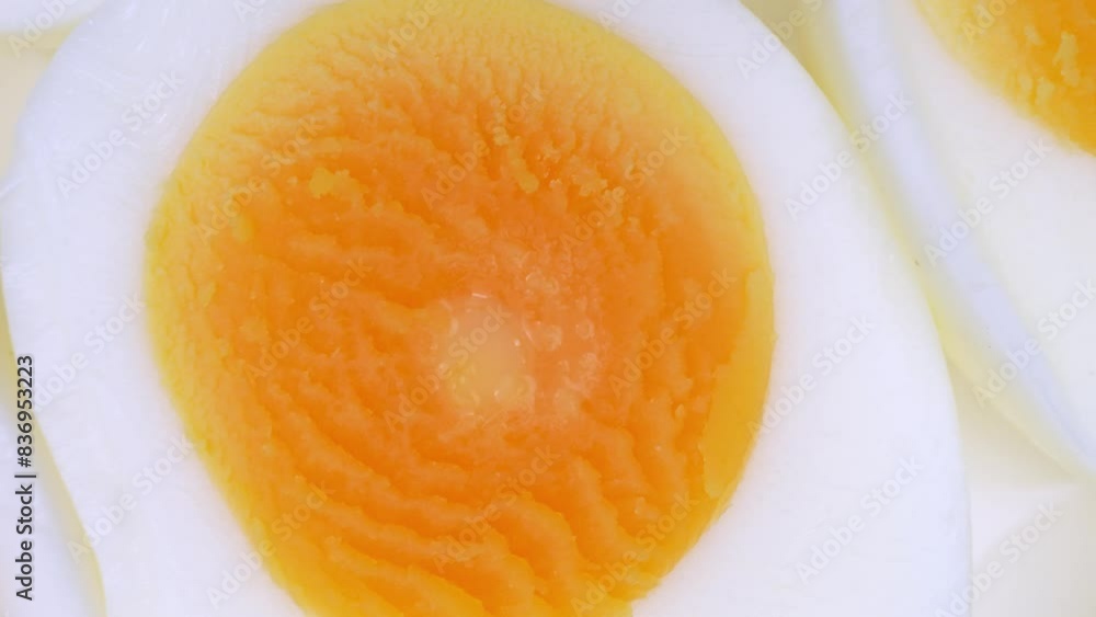 Sliced boiled eggs, each halved, exhibit vibrant yellow yolks encircled by resilient, snow-white egg whites. Their texture suggests firmness, indicative of a perfectly hard-boiled consistency.
Sliced boiled eggs, each halved, exhibit vibrant yellow yolks encircled by resilient, snow-white egg whites. Their texture suggests firmness, indicative of a perfectly hard-boiled consistency.
