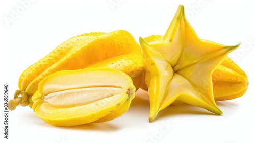 A high-resolution image of a whole and sliced starfruit, isolated on a white background with clipping path photo
