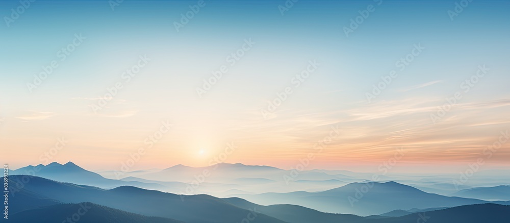Obraz premium Beautiful sunset behind the mountains with a beautiful blue sky. Creative banner. Copyspace image