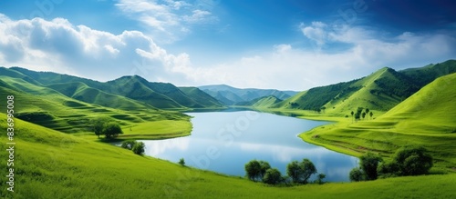 blue lake on a background of green hills. Creative banner. Copyspace image