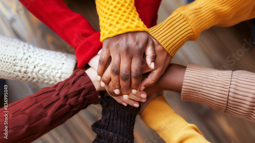 A group of people are holding hands in a circle