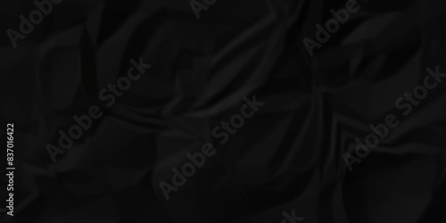 	Abstract dark black wave paper crumpled texture. black fabric textured crumpled paper background. panorama black wrinkly paper texture background, crumpled pattern texture background. photo