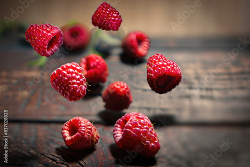 raspeberries on wooden table photo