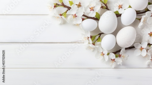 Sakura blossom flower, white happy easter eggs on white wood spring background