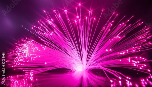 Vivid pink fiber optic lights fanning out in a mesmerizing display, creating a dynamic visual effect. The radiant beams and sparkling dots evoke innovation, advanced technology. © CoffeeeCraze