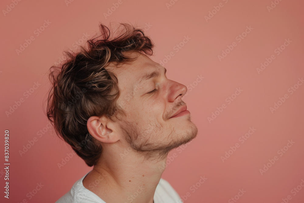 Fototapeta premium A close up of a man with beard and closed eyes looking to a side