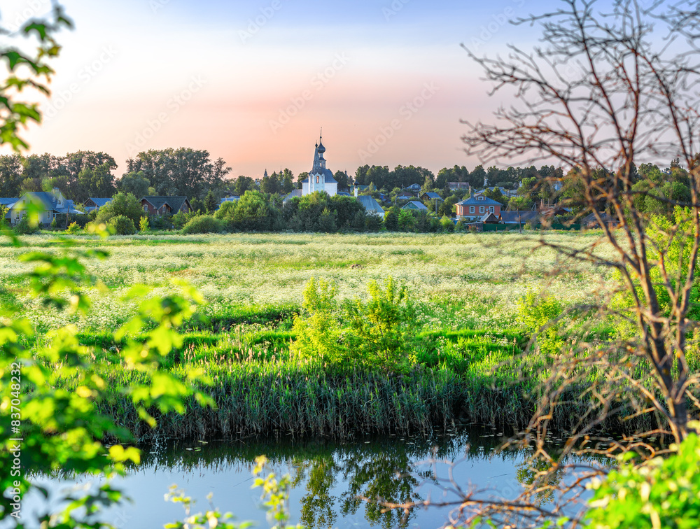 Suzdal, Vladimir region, Russia, Golden Ring - Panorama of the flood meadow and the Church of the Nativity of John the Baptist and the Church of the Epiphany Suzdal, Vladimir region, Russia, Golden Ring - Panorama of the flood meadow and the Church of the Nativity of John the Baptist and the Church of the Epiphany