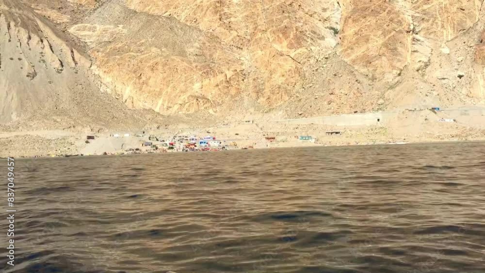 Boat ride in Attabad lake and rough mountains of Hunza nagar Pakistan Boat ride in Attabad lake and rough mountains of Hunza nagar Pakistan