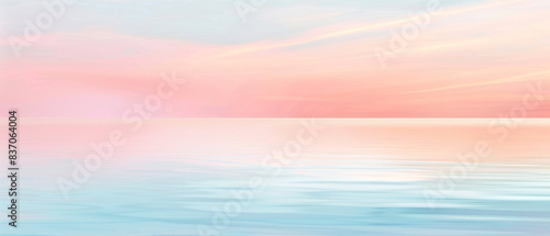 A beautiful pink and blue sky with a calm ocean