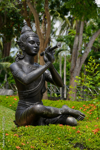 Thai statue Phra Aphai Mani in the park photo