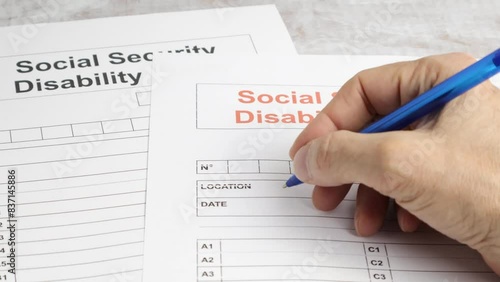 Person Filling Social Security Disability Claim Form