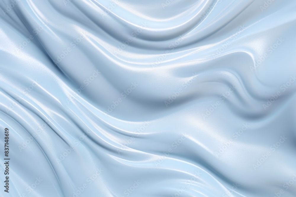 Fototapeta premium A blue fabric with a wave pattern. The fabric is smooth and shiny