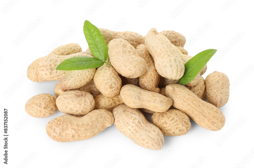 Fresh unpeeled peanuts and green leaves isolated on white Fresh unpeeled peanuts and green leaves isolated on white