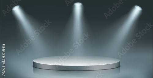 Round podium illuminated by searchlights. Blank background for the presentation.