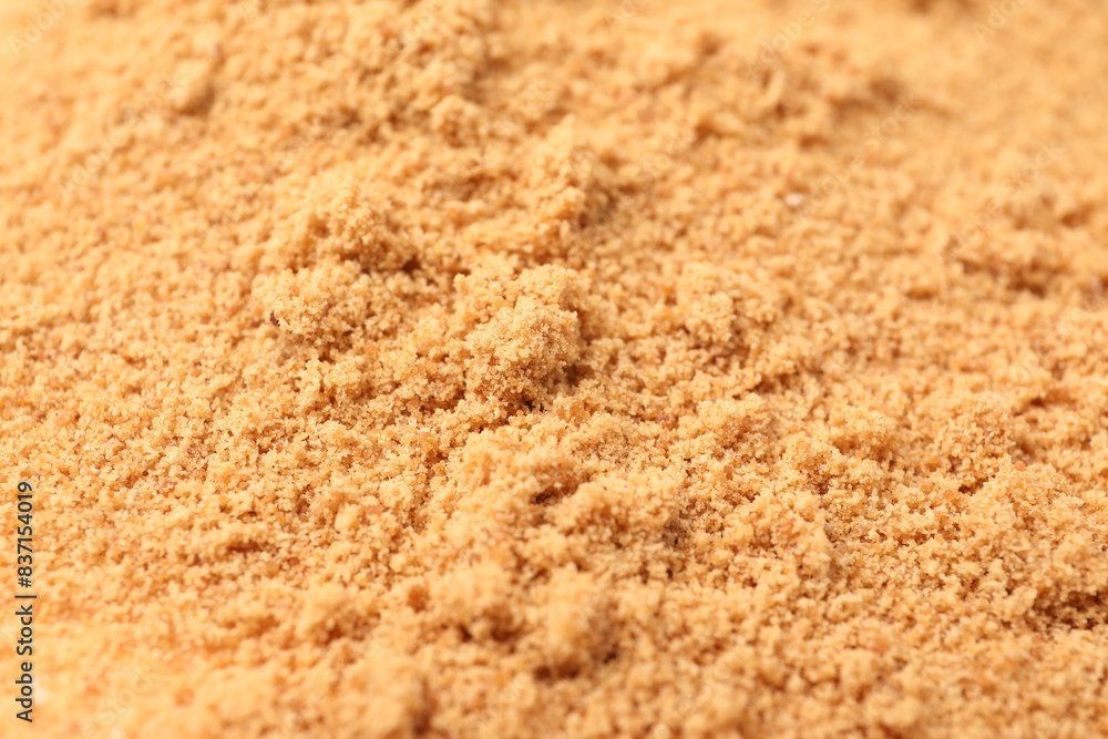 Brown coconut sugar as background, closeup view Brown coconut sugar as background, closeup view