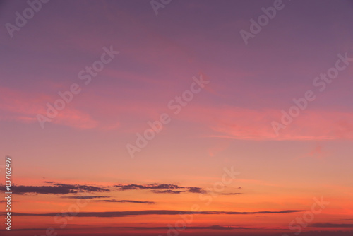 Sunrise  sunset pink violet orange sky with clouds background texture