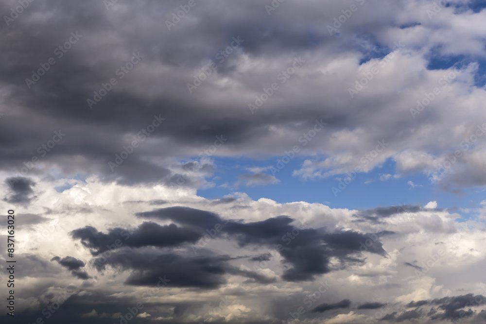 Epic Dramatic storm dark grey cumulus rain clouds against blue sky background texture, thunderstorm Epic Dramatic storm dark grey cumulus rain clouds against blue sky background texture, thunderstorm