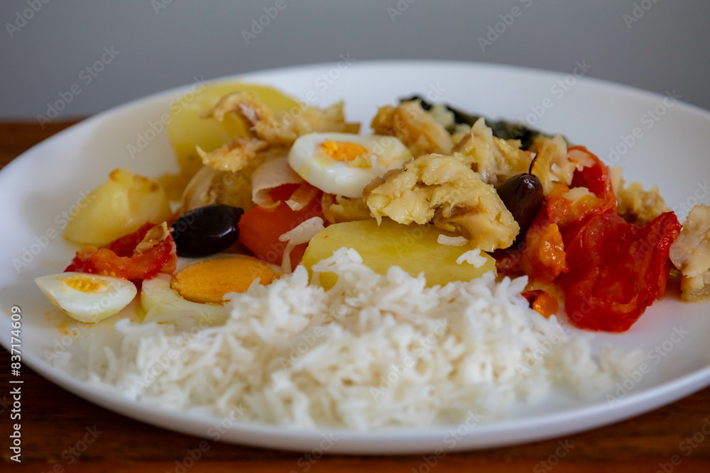 Traditional Portuguese bacalhoada with classic ingredients. When cod Oven Traditional Portuguese bacalhoada with classic ingredients. When cod Oven