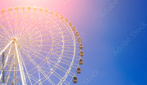 white big Ferris wheel on background a blue sky in the amusement park in summer with copy space