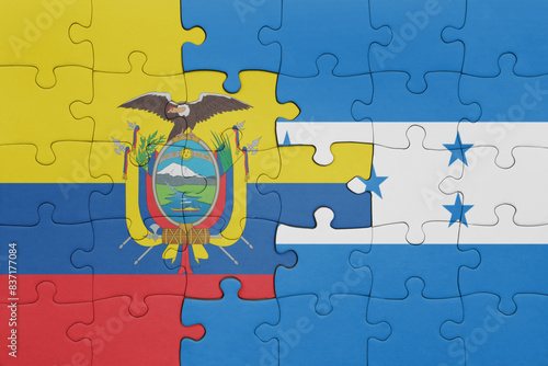 puzzle with the colourful national flag of honduras and flag of ecuador.