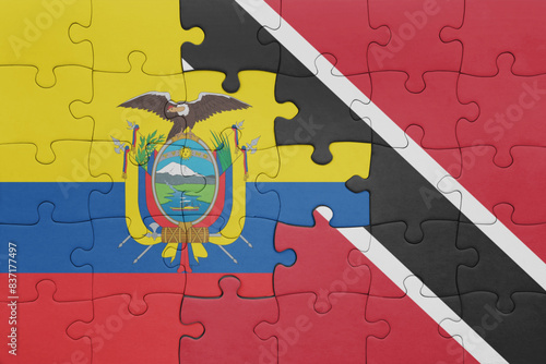 puzzle with the colourful national flag of trinidad and tobago and flag of ecuador.