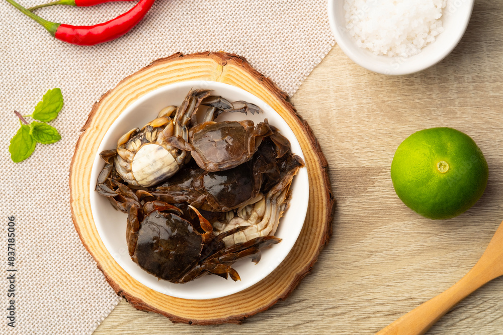 Salted crab,preserved crab with salt in white plate.Top view Salted crab,preserved crab with salt in white plate.Top view