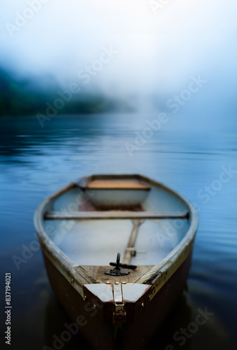 Rowing Boat On Misty Lake