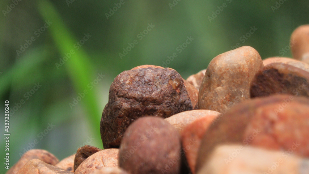 Closeup of piled brown cobblestones