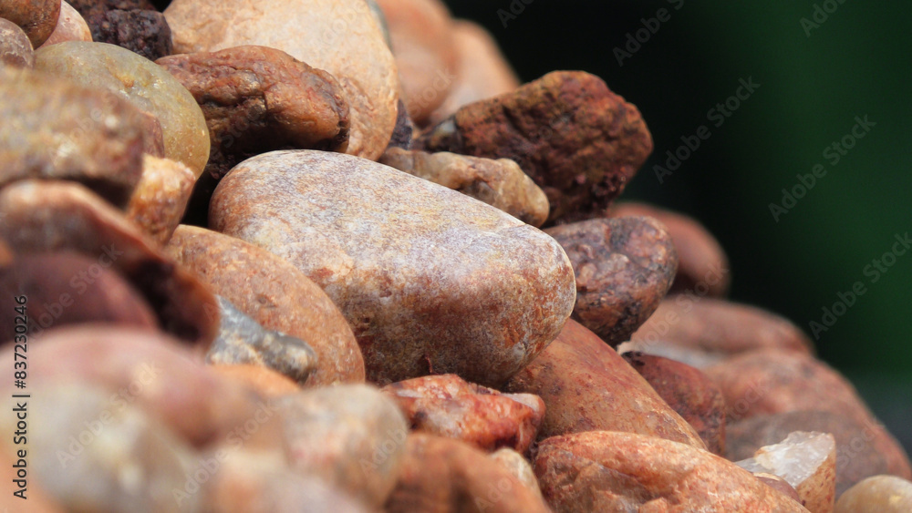 Closeup of piled brown cobblestones Closeup of piled brown cobblestones