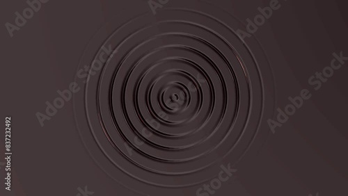 Abstract animated dark gray background. Indented circles moving outwards. 4k ready to loop photo