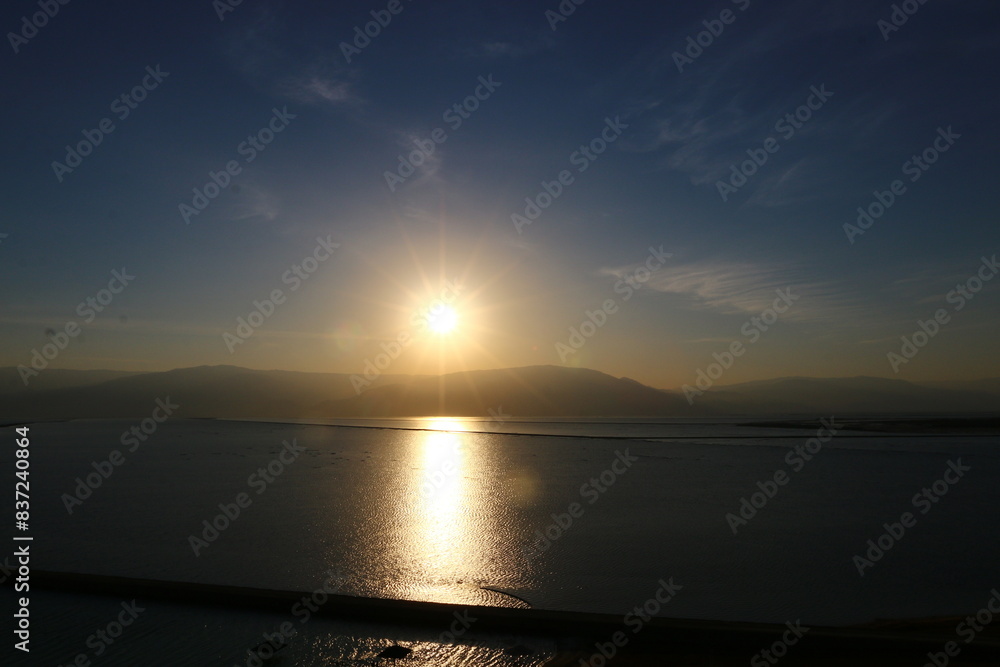 Fototapeta premium The sunrise on the shores of the Dead Sea