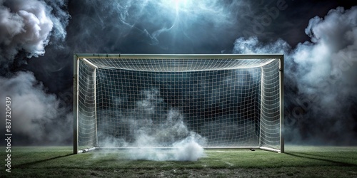 Football goal with net in fog and smoke on dark background photo