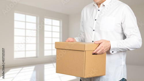 Man with box. Moving to new...
