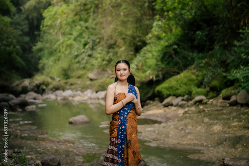 Asian woman wearing "Kemben" batik cloth © ajiilhampratama