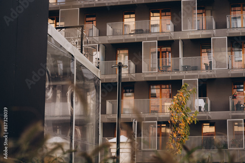 Fotografija Modern urban view, building facade of multi storey residential building with bal