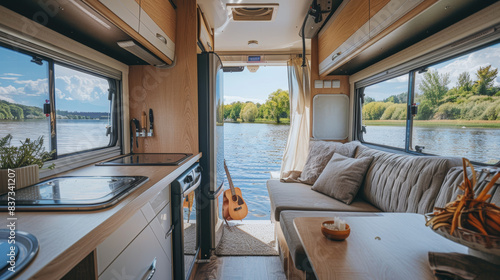 Interior of a trailer of mobile home, or recreational vehicle standing on the shore. Camping in the nature, and family travel concept photo